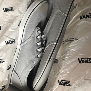 white vans with dark blue stripes